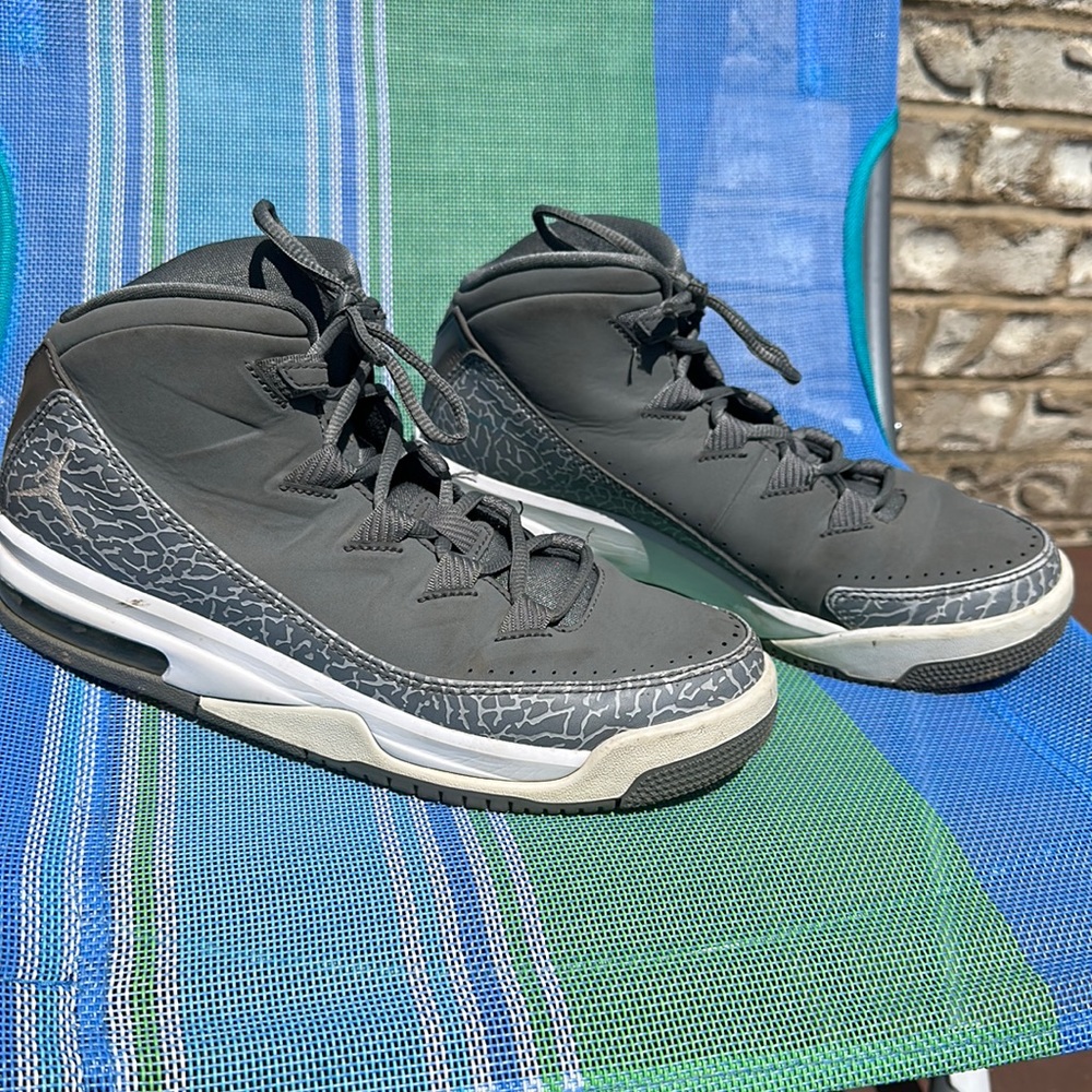 White and gray basketball shoes, Jordan’s